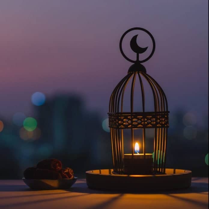 image of a laltain with moon logo and some dates are laying on a table showing ramadan mubarak dp