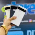 A man holding 3 Google phones