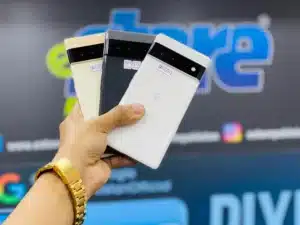 A man holding 3 Google phones
